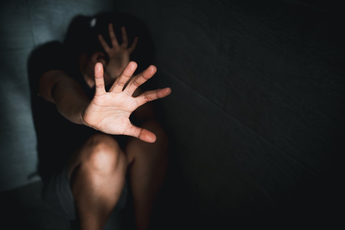 Stop harassment violence concept. Boss or employer sexually harassed a business woman at work. Depressed girl sitting in corner. stop violence against Women, international women's day.